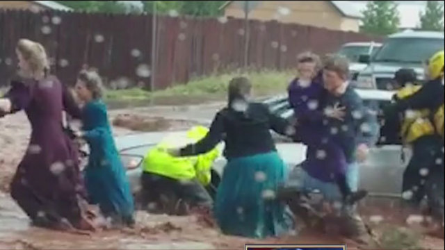 The Latest: Boy who survived flooding climbed out car window