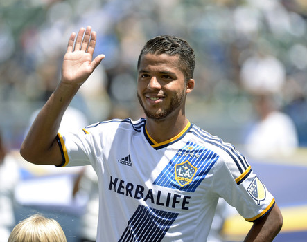 Giovani Dos Santos #10 of the Los Angeles Galaxy acknowledges cheers from fans as he makes his MLS debut before the start of soccer match between Los Angeles Galaxy and Seattle Sounders at Stub Hub Center