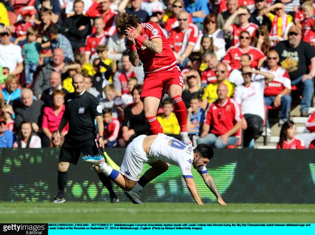 Middlesbrough's Fernando Amorebieta clashes heads with Leeds United's Alex Mowatt