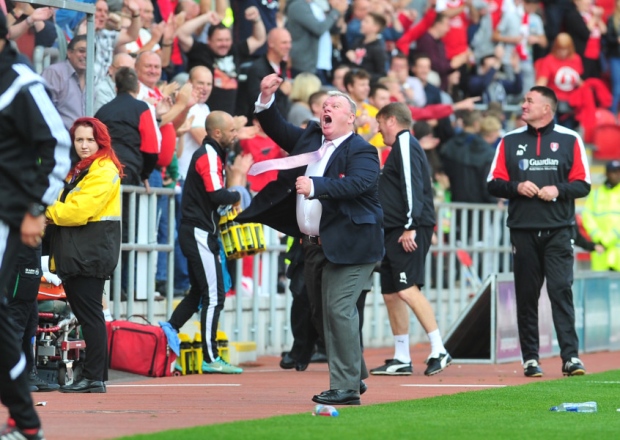 Millers gaffer Steve Evans celebrates his teams first win of the season at the final whistle