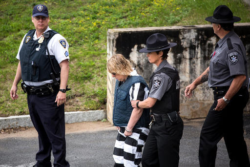 Joyce Mitchell a prison worker who allegedly helped two convicts escape from prison is lead from Plattsburgh Ciy Court after a hearing