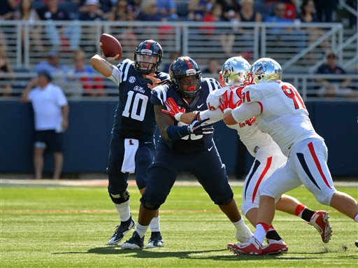 Mississippi quarterback Chad Kelly releases a pass during the first half of an NCAA college football game against Fresno State in Oxford Miss. Saturday Sept. 12 2015