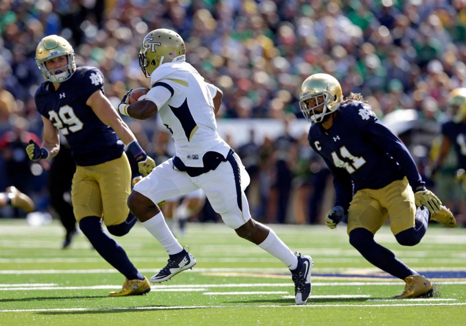 Notre Dame cornerback Matthias Farley and safety Nicky Baratti chase Georgia Tech running back Brady Swilling during the first half of an NCAA college football game in South Bend Ind. Defensive back