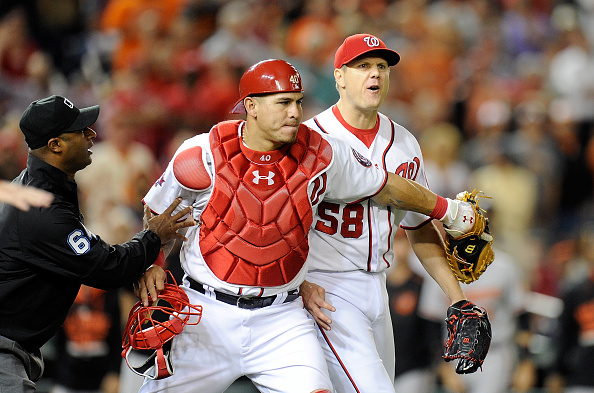 WASHINGTON DC- SEPTEMBER 23 Jonathan Papelbon #58 of the Washington Nationals is restrained by Wilson Ramos #40 after being thrown out of the game in the ninth inning against the Baltimore Orioles at Nationals Park