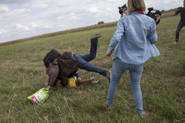 Video: Employee of Right-Wing Hungarian TV Channel Trips, Kicks Refugees