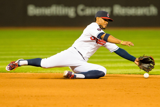 Shortstop Francisco Lindor #12 of the Cleveland Indians fields a ground ball hit by Salvador Perez #13 of the Kansas City Royals during the fifth inning at Progressive Field