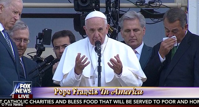 Quitting John Boehner weeps on a balcony of Congress as the Pope blesses crowds outside