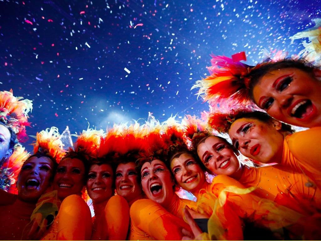 Performers pose after the end of closing ceremony of the London 2012 Olympic Games at the Olympic stadium