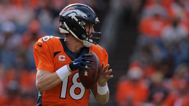 DENVER CO- SEPTEMBER 13 Quarterback Peyton Manning #18 of the Denver Broncos delivers a pass against the Baltimore Ravens at Sports Authority Field at Mile High