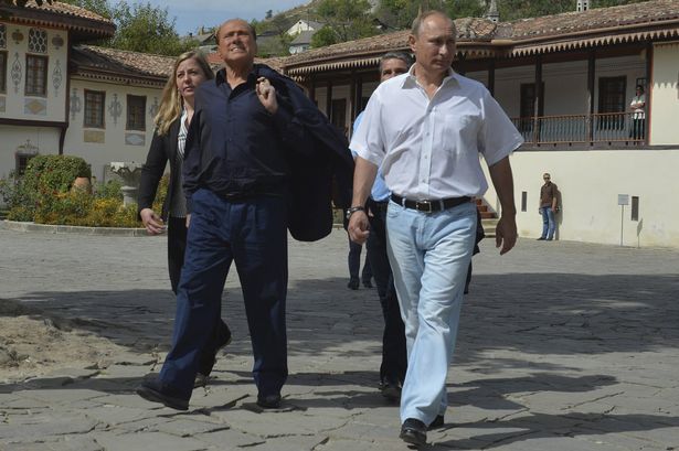 Russian President Vladimir Putin and former Italian Prime Minister Silvio Berlusconi visit the Bakhchisarai Historical Cultural and Archaeological Museum Preserve in Crimea