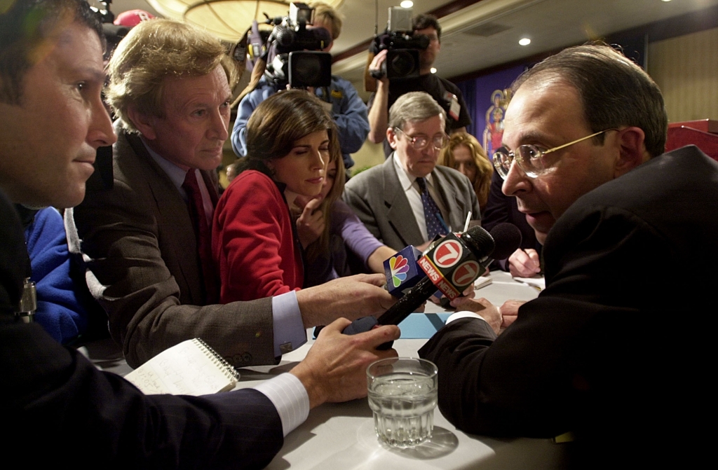 Bishop of Bridgeport William Lori answers questions regarding sexual abuse in the church from the news media 11 November 2002 after a press conference during the US Conference of Catholic Bishops being held in the Capitol Hyatt in Washington DC. The US C