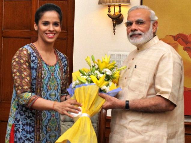 Prime Minister Narendra Modi with Badminton player Saina Nehwal in New Delhi on Wednesday