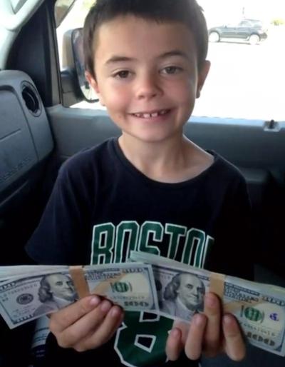 Salem's Aiden Wright 7 found $8,000 on a playground Saturday