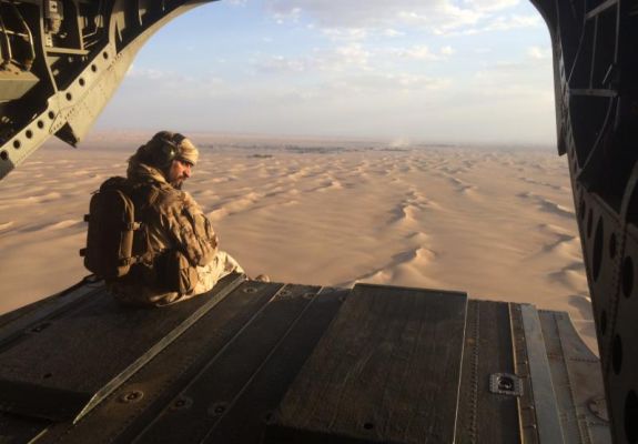 An Emirati gunner watches for enemy fire from