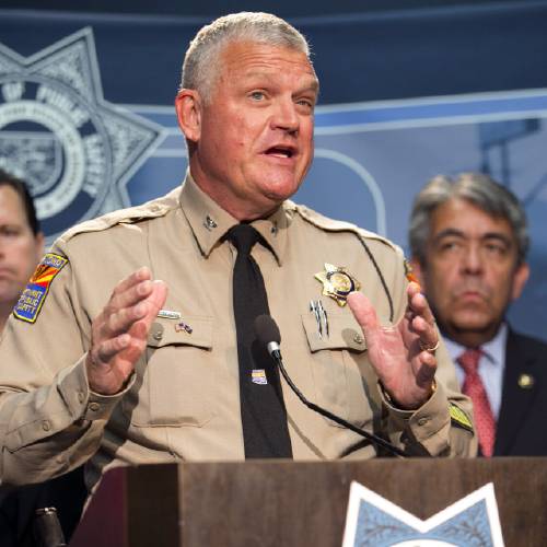 Milstead Director of the Department of Public Safety speaks during a press conference to announce the arrest of a suspect in the Phoenix freeway shootings at DPS headquarters in Phoenix on Friday Sept. 18 2015. He is flanked by A