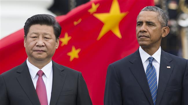 US President Barack Obama and Chinese President Xi Jinping stand during a State Arrival ceremony on the South Lawn of the White House in Washington DC