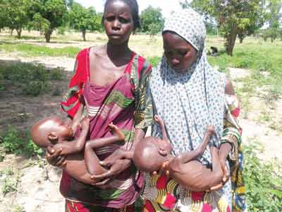 Two rescued women and their children