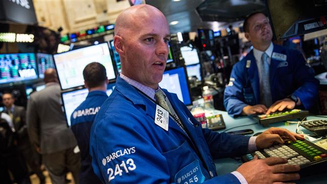 An AFP image shows traders working on the floor of the New York Stock Exchange on September 17th