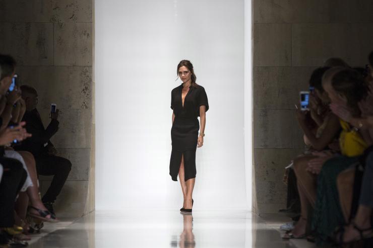 Designer Victoria Beckham acknowledges attendees after presenting her Spring  Summer 2016 collection