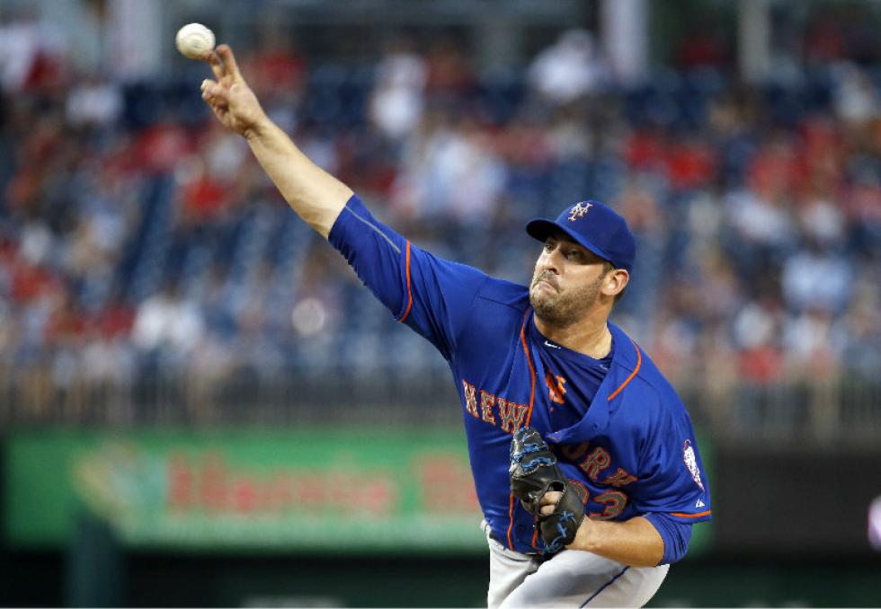 Associated Press
New York Mets starting pitcher Matt Harvey throws against the Washington Nationals on Tuesday at Nationals Park in Washington.
The Mets won 8-7