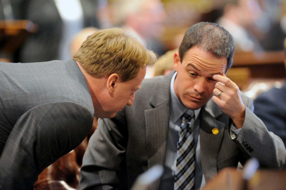 House Democratic Leader Rep. Tim Greimel left and House Speaker Rep. Kevin Cotter right speak Thursday Sept. 10 2015 in Lansing Mich. The Michigan House was at a standstill Thursday night over whether to expel Rep. Cindy Gamrat and Rep. Todd Cou