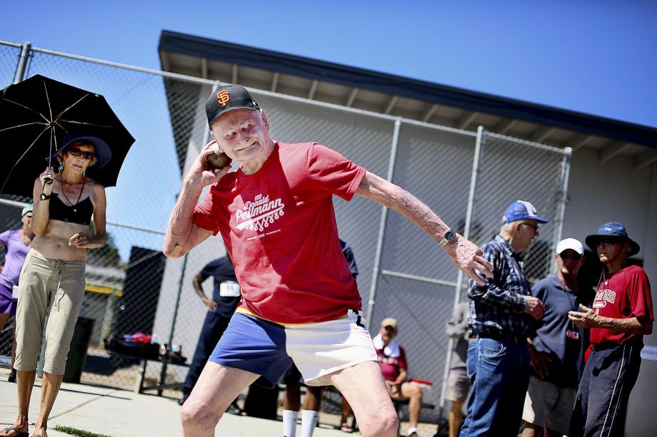 Don Pellmann a 100-year-old Santa Clara man puts the shot while competing in the San Diego Senior Games at Mesa College in San Diego. His mark in the event was one of five age-100 world records he set at the games