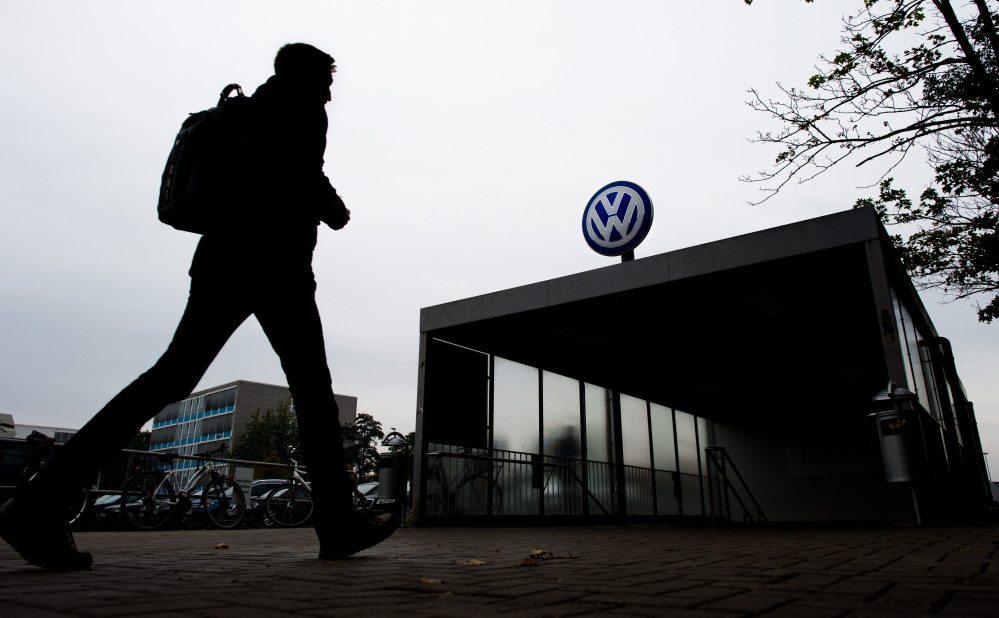A VW employee enters the Volkswagen factory site through Gate 17 in Wolfsburg Germany