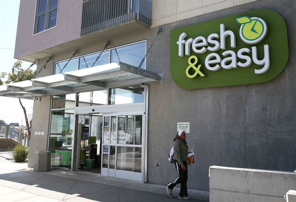 Image A customer leaves a Fresh and Easy grocery store in San Francisco