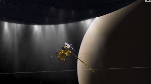 A rendering of the Cassini Orbiter passing through an icy plume off the south pole of Saturn's Enceladus