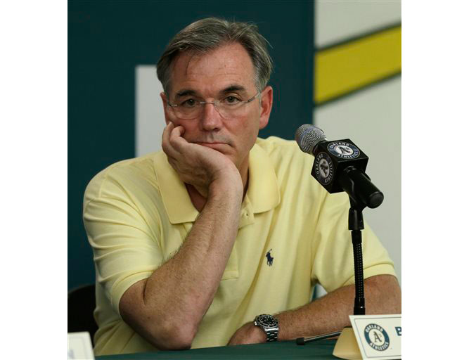 Oakland Athletics general manager Billy Beane looks on during a news conference in Oakland Calif. Athletics executive Billy Beane and a retired Chevron Oil executive are among the top excessive water users in a district