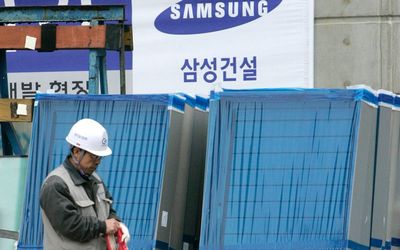 A worker walks at a construction site of Samsung Engineering in Seoul