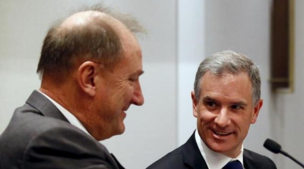 Brookfield Infrastructure Chief Executive Sam Pollock smiles as he speaks with Asciano Ltd Chief Executive Officer John Mullen during a media conference in Sydney Australia