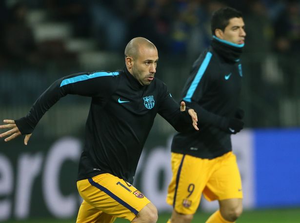 Javier Mascherano warms