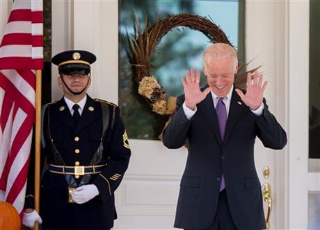 Vice President Joe Biden reacts to questions about a potential run for president by members of the media as he waits for South Korean President Park Geun-hye to arrive for lunch at the Naval Observatory Thursday Oct. 15 2015 in Washington