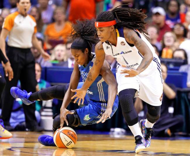 Minnesota’s Devereaux Peters left and Indiana’s Shavonte Zellous battling Sunday during Game 4 of the WNBA Finals