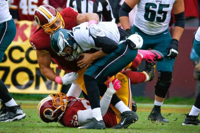 Redskins linebackers Ryan Kerrigan top and Trent Murphy sacking Eagles QB Sam Bradford in the closing seconds Sunday