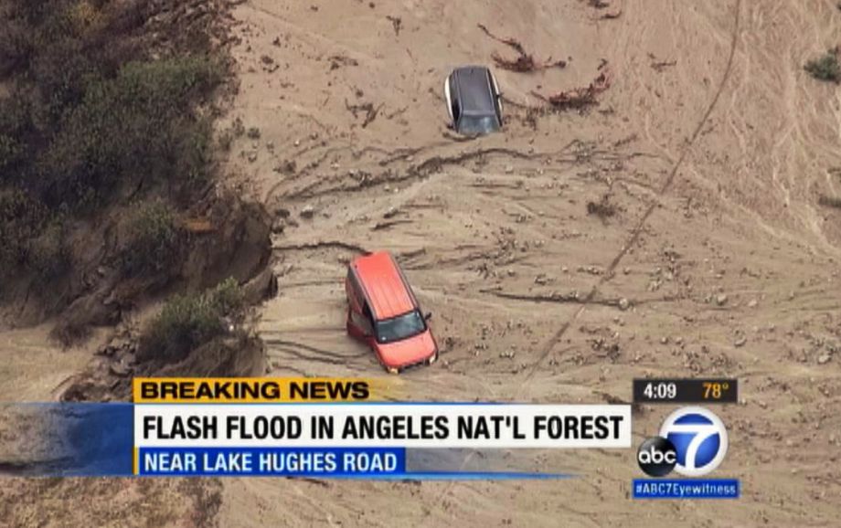 This image made from video provided by KABC-TV shows cars caught in mud in Lake Hughes Calif. Friday Oct. 16 2015 after torrential rains Thursday caused mudslides that carried away vehicles and closed roads about 70 miles north of Los Angeles. Rescue