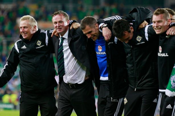 Northern Ireland manager Michael O'Neill celebrates with his team at the end of the match