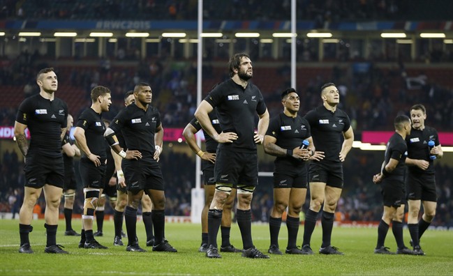 New Zealand players face the crowd after their 43-10 win in the Rugby World Cup Pool C match between New Zealand and Georgia at the Millennium Stadium Cardiff Friday Oct. 2 2015