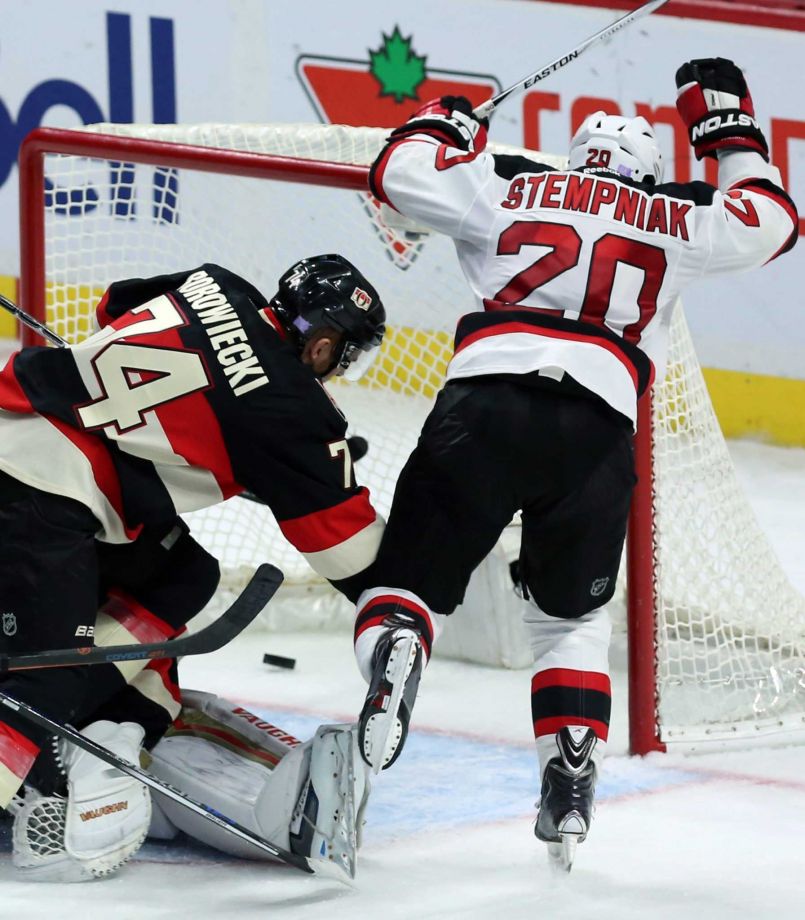 New Jersey Devils Lee Stempniak right celebrates his tying goal as Ottawa Senators Mark Borowiecki defends during the third period of an NHL hockey game Thursday Oct. 22 2015 in Ottawa Ontario. The Devils defeated the Senators 5-4. (Fred Char