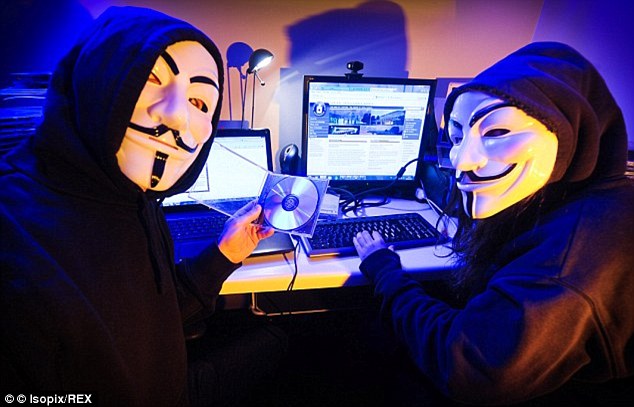 Members of the hacking group Anonymous. They have threatened to reveal the identities of 1,000 members of the Ku Klux Klan to mark the first anniversary of the Ferguson protests