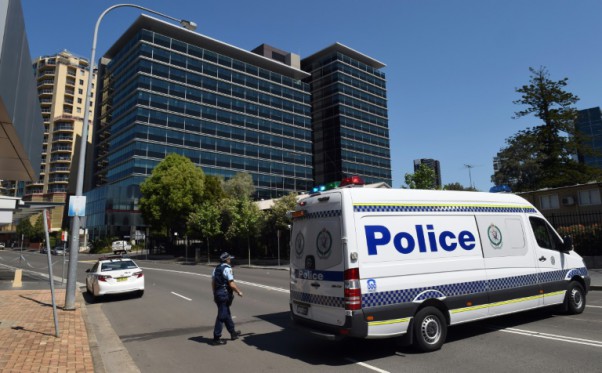 AFP  File  William West Police block off the scene near New South Wales Police Headquarters where a 15-year-old gunman shot dead a civilian police employee in Sydney