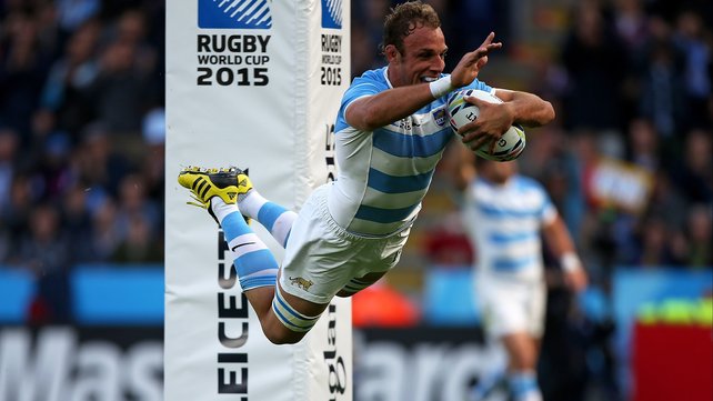 Argentina's PJ van Lill dives to score a try against Namibia