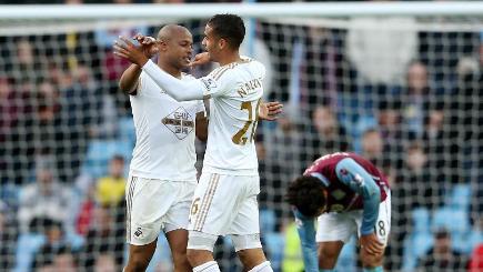 Swansea's Andre Ayew left celebrates with Kyle Naughton after scoring the winner in Saturday's 2-1 victory at Aston Villa