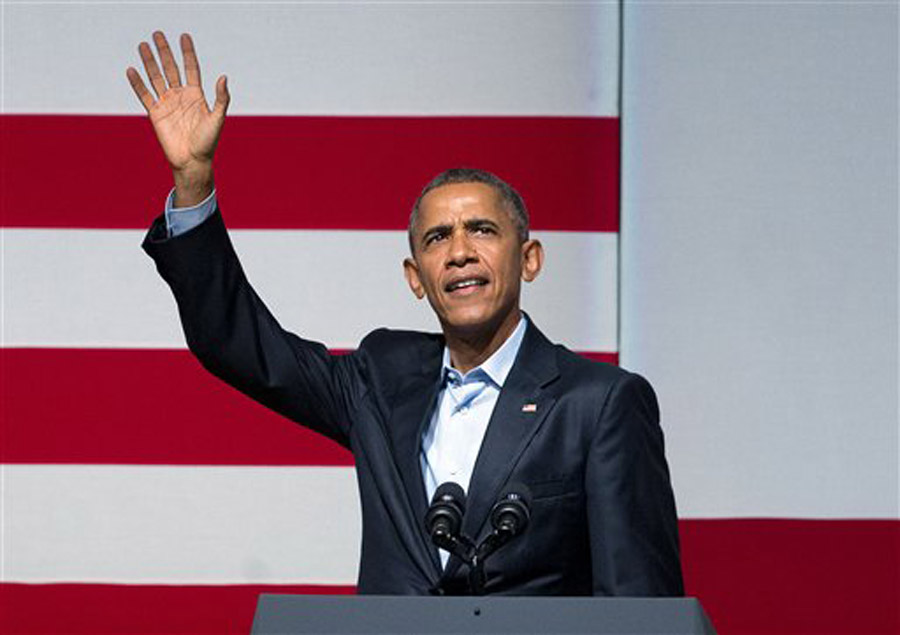 President Barack Obama waves to guests as he takes the stage during a Democratic fundraiser at the Warfield Theater Saturday Oct. 10 2015 in San Francisco