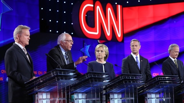 All 5 behind lecterns debate