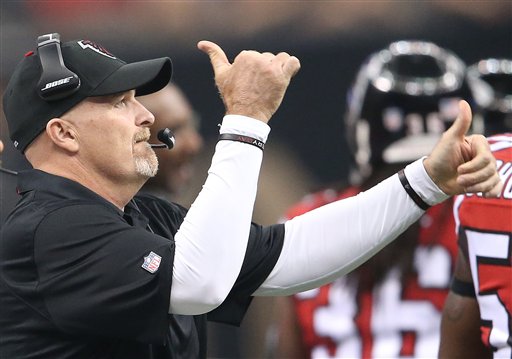 Atlanta Falcons head coach Dan Quinn signals to Atlanta Falcons players during the first half of an NFL football game against the New Orleans Saints in New Orleans. The New Orleans Saints won 31-21. The Falcons fina