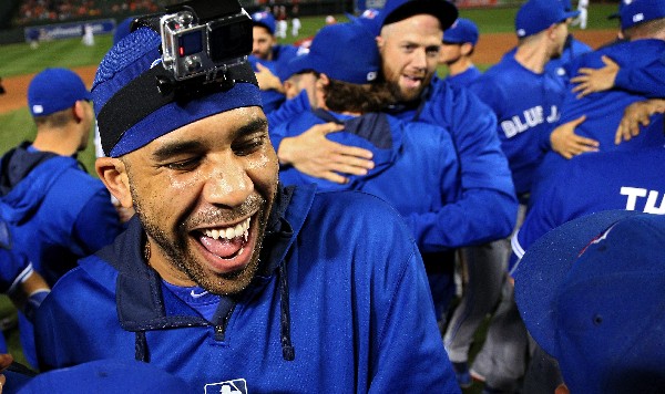 BALTIMORE MD- SEPTEMBER 30 Pitcher David Price #14 of the Toronto Blue Jays and teammates celebrate after defeating the Baltimore Orioles and clinching the AL East Division during game one of a double header at Oriole Park at Camden Yards on September