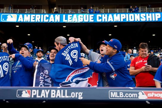 Toronto Blue Jays fans cheer before playing against the Kansas City Royals during game one of the ALCS playoff baseball action in Kansas City Mo. on Friday