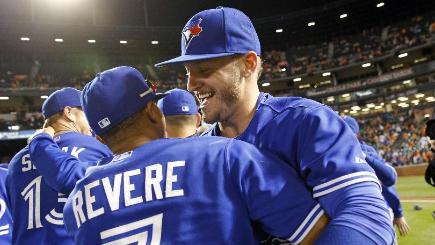 Toronto Blue Jays&#39 Josh Donaldson right celebrates with Ben Revere after beating the Baltimore Orioles